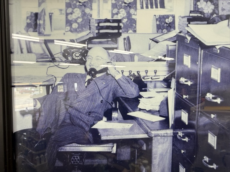A second view of Lewis at the desk