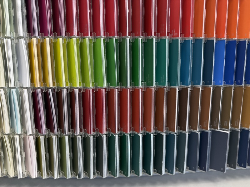 Wall of paint chip samples in a full rainbow of colors