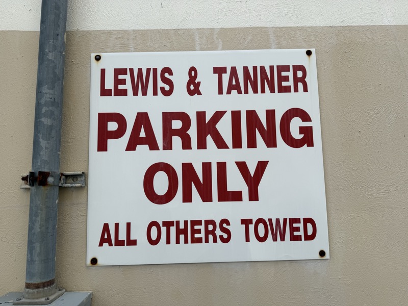 Lewis & Tanner parking-only sign